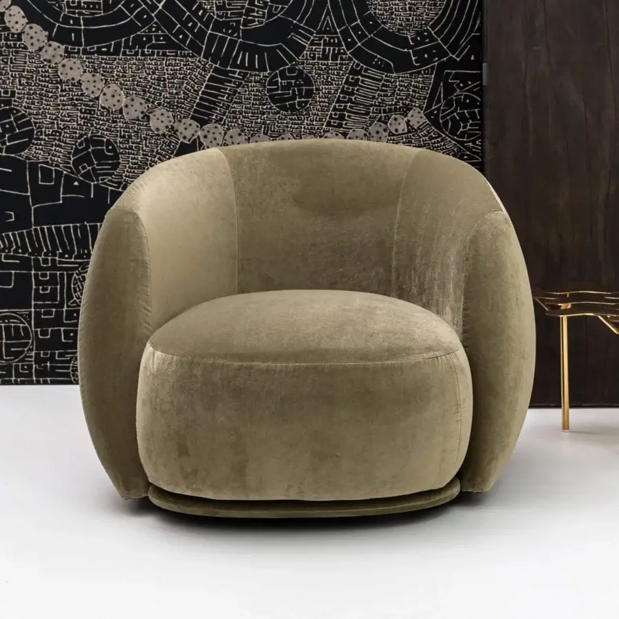 Superior Moroso Pacific lounge chair with curved silhouette upholstered in muted olive green textile and internal steel frame