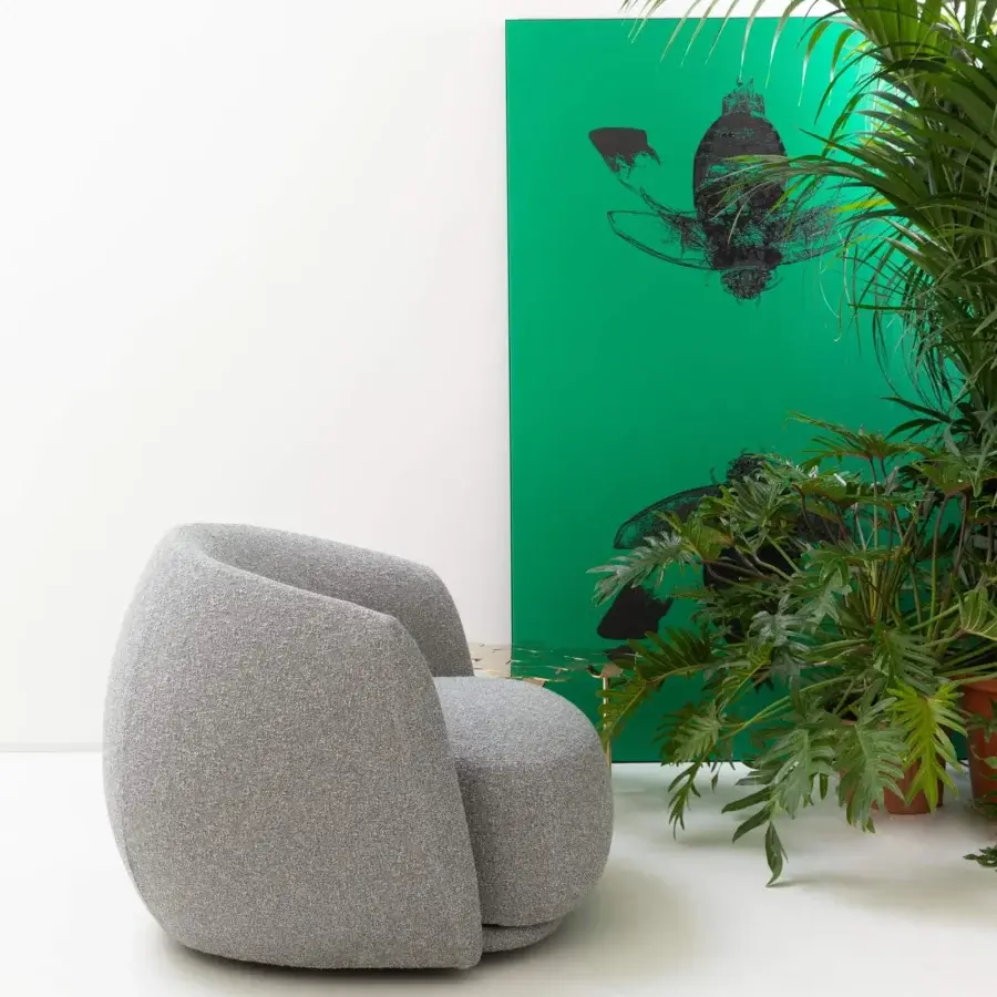Distinguished Moroso Pacific lounge chair with enveloping rounded shapes upholstered in textured medium gray textile and steel frame