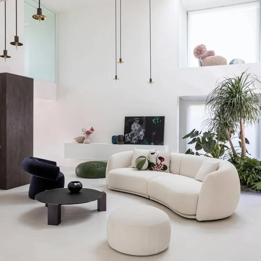 Lavish Moroso Pacific sofa with enveloping form upholstered in textured off-white textile and refined wooden steel structure