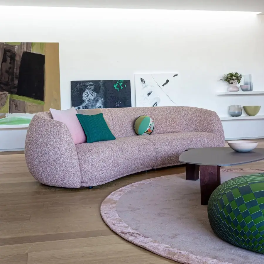 Distinguished Moroso Pacific sofa with enveloping form upholstered in light pink tightly woven textile and wooden steel structure