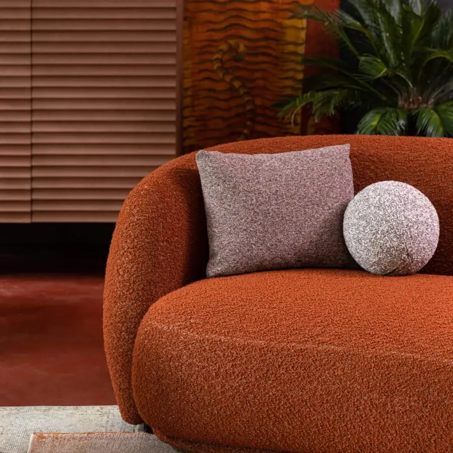 Superior Moroso Pacific sofa with rounded silhouette upholstered in textured orange textile and black polypropylene glides
