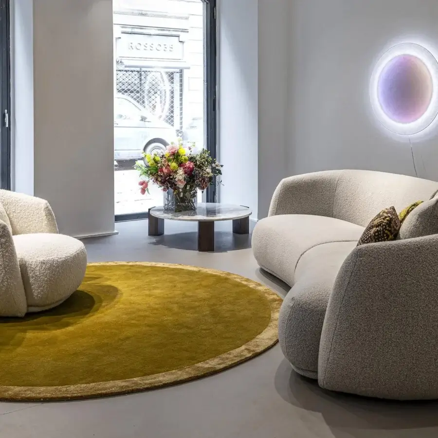Exceptional Moroso Pacific sofa and armchair with relaxed form upholstered in textured off-white fabric and wooden steel structure