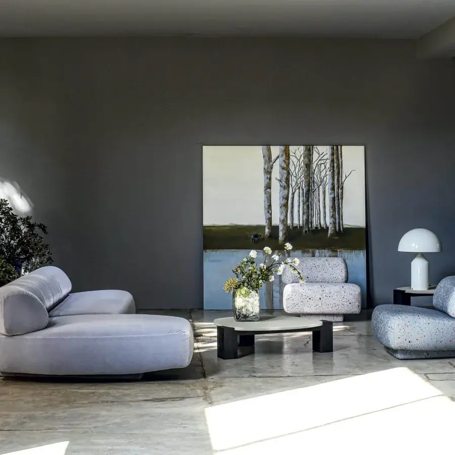 Exceptional Moroso Gogan lounge chair with speckled textile upholstery in blue, grey, black, and orange tones with wooden structure
