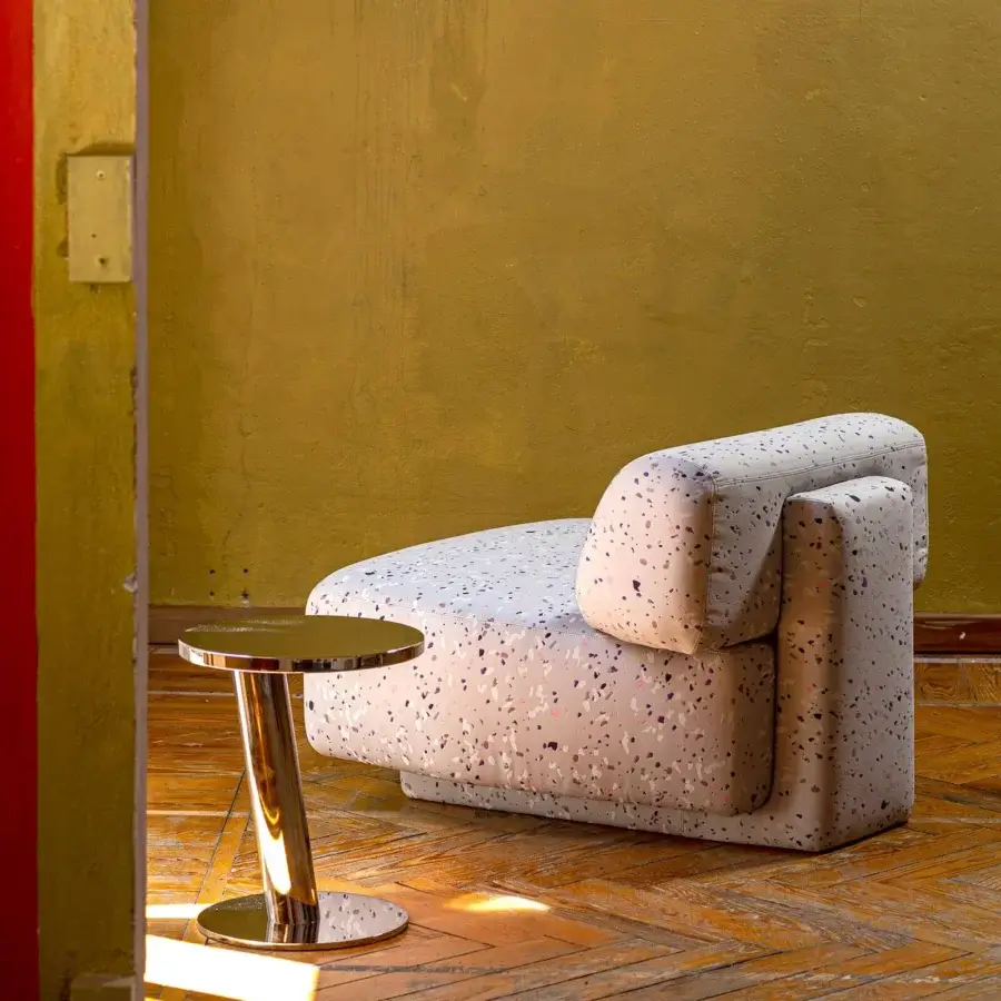 Distinguished Moroso Gogan lounge chair with light grey speckled textile upholstery and smooth contemporary finish