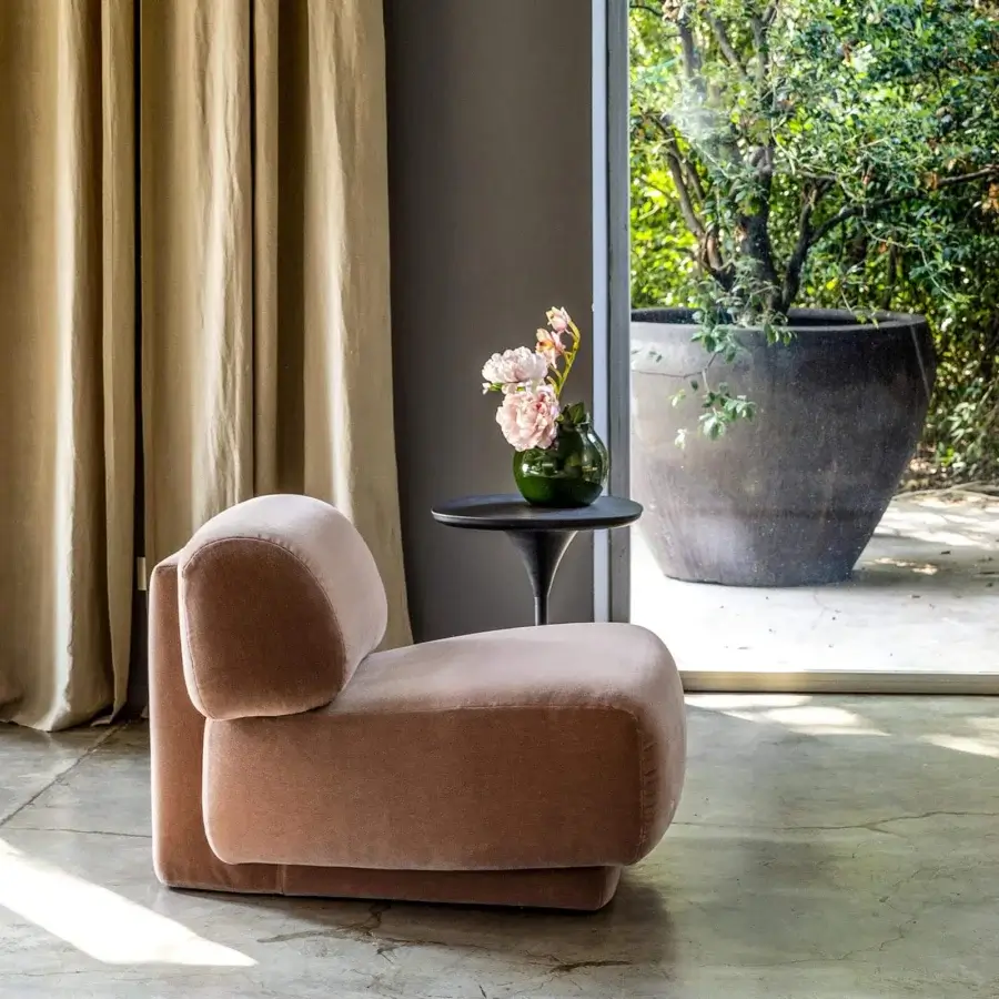 Distinguished Moroso Gogan lounge chair with light brownish-pink textile upholstery and smooth finish built with a wooden structure