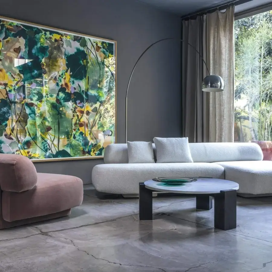 Elegant Moroso Gogan lounge chair with light pink textile upholstery and curved polyurethane foam construction