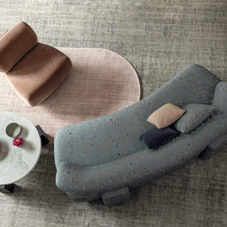 Superior Moroso Gogan lounge chair with plush light brown fabric upholstery and rounded geometric forms built with a wooden structure