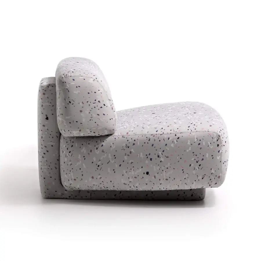 Superior Moroso Gogan lounge chair with light gray fabric upholstery exhibiting white, pink, and dark purple spots and a wooden structure