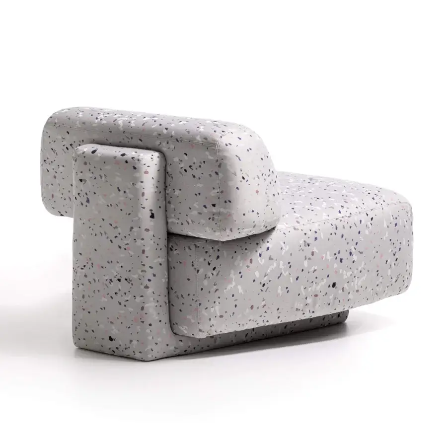 Distinguished Moroso Gogan lounge chair with terrazzo-patterned purple, pink, gray, and white fabric upholstery and black polypropylene glides