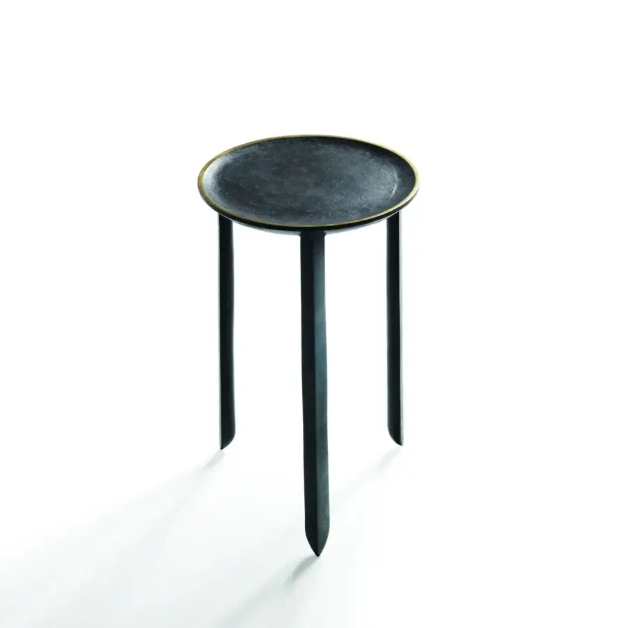 Exclusive Bellavista Batista table with cast aluminum structure and dark, round top trimmed with polished brass