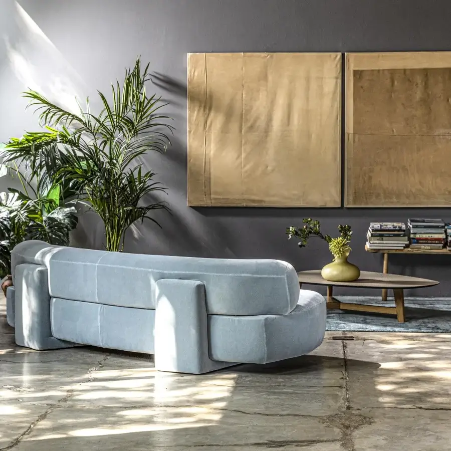 Distinguished Moroso Gogan sofa presenting a textile finish in light blue-grey with curved edges and an inviting, subtly inclined seat