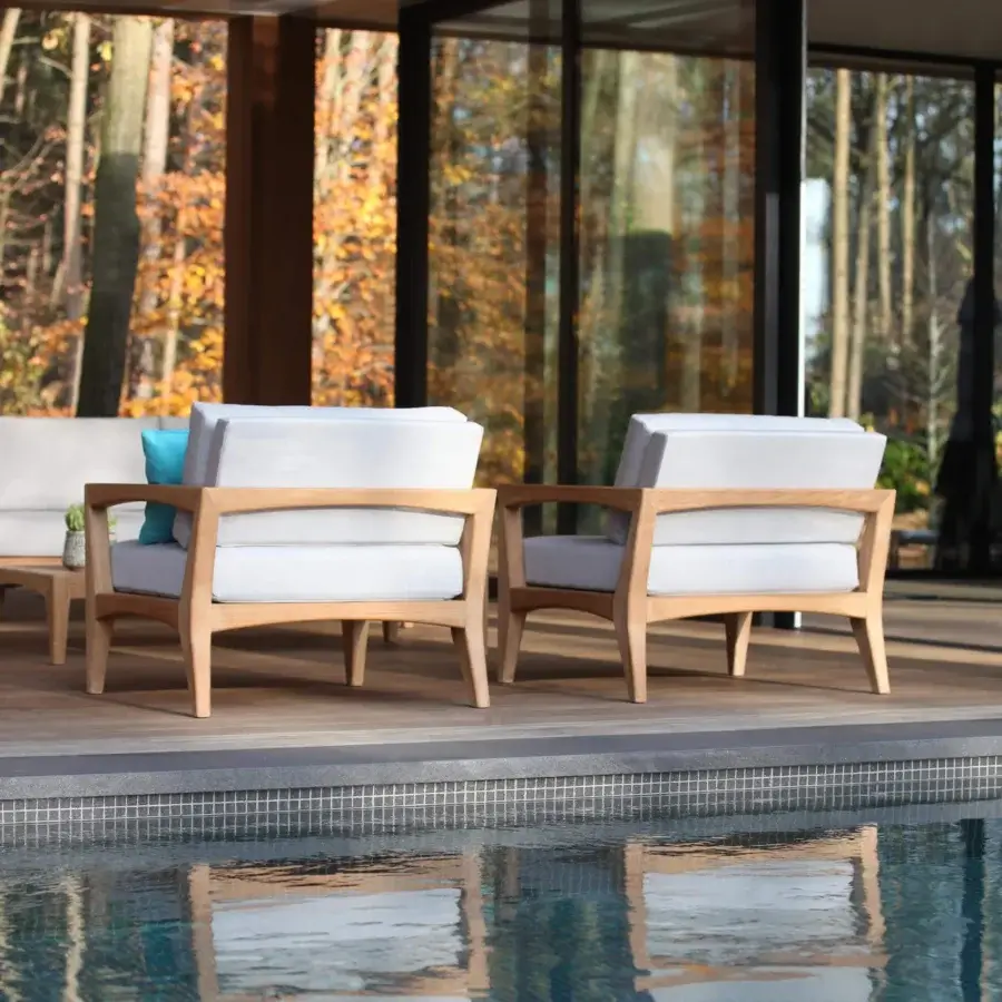 Distinguished Royal Botania Zenhit lounge chair with teak wood structure and white fabric cushions exhibiting contemporary elegance