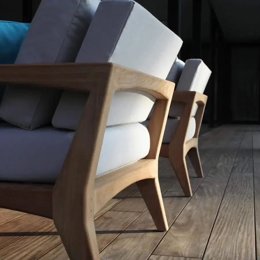 Exceptional Royal Botania Zenhit lounge chair with teak wood structure and crisp white cushions offering a contemporary design