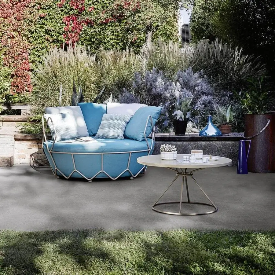 Distinguished Roberti rattan coffee table with light powder-coated aluminum and brass-toned stainless steel base in matte finish