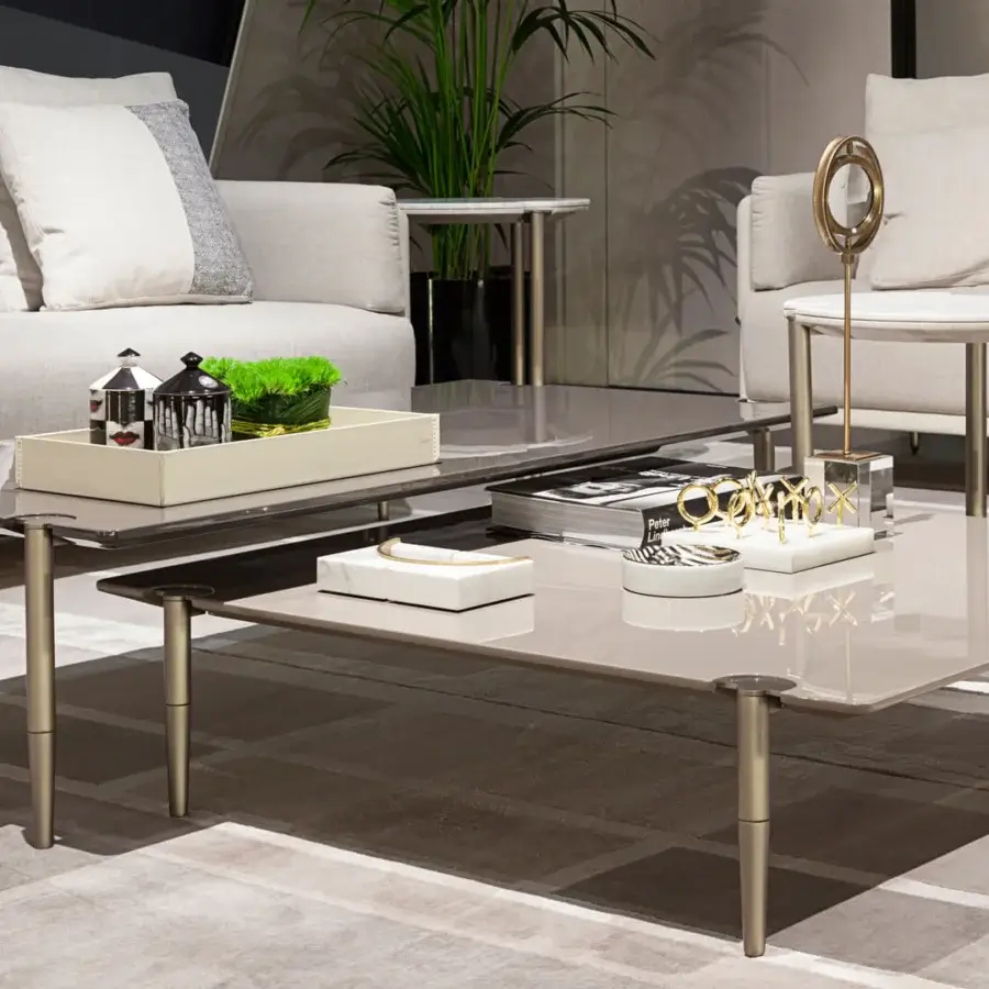 Elegant Turri Zero coffee table with layered wooden tops revealing glimpses of a matte metal structure and glossy taupe lacquer