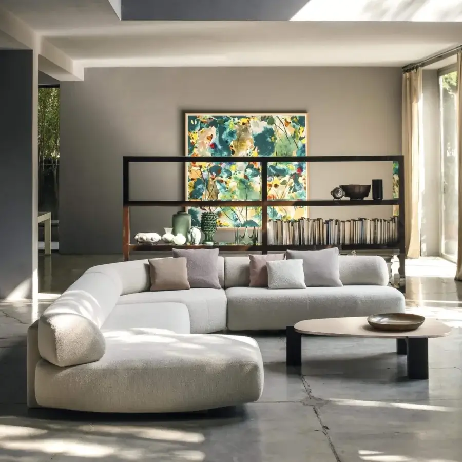 Elegant Moroso Gogan sectional with sculpted seats upholstered in textured off-white fabric and black polypropylene glides