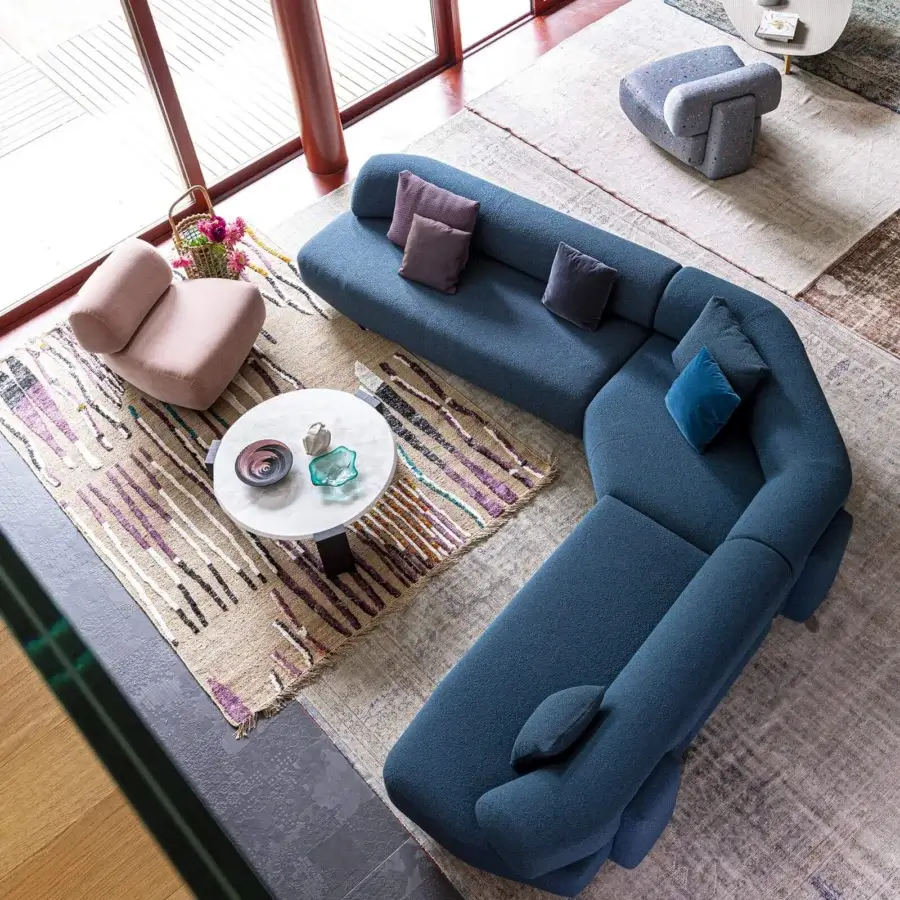 Exceptional Moroso Gogan sectional with a wooden structure upholstered in dark blue fabric and plush square pillows