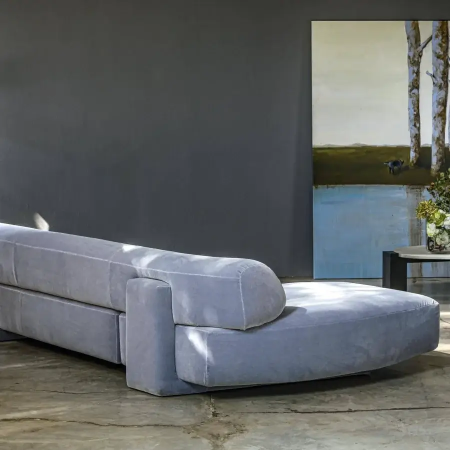 Innovative Moroso Gogan sectional in light gray textile with a rounded design and black polypropylene glides crafted in Italy
