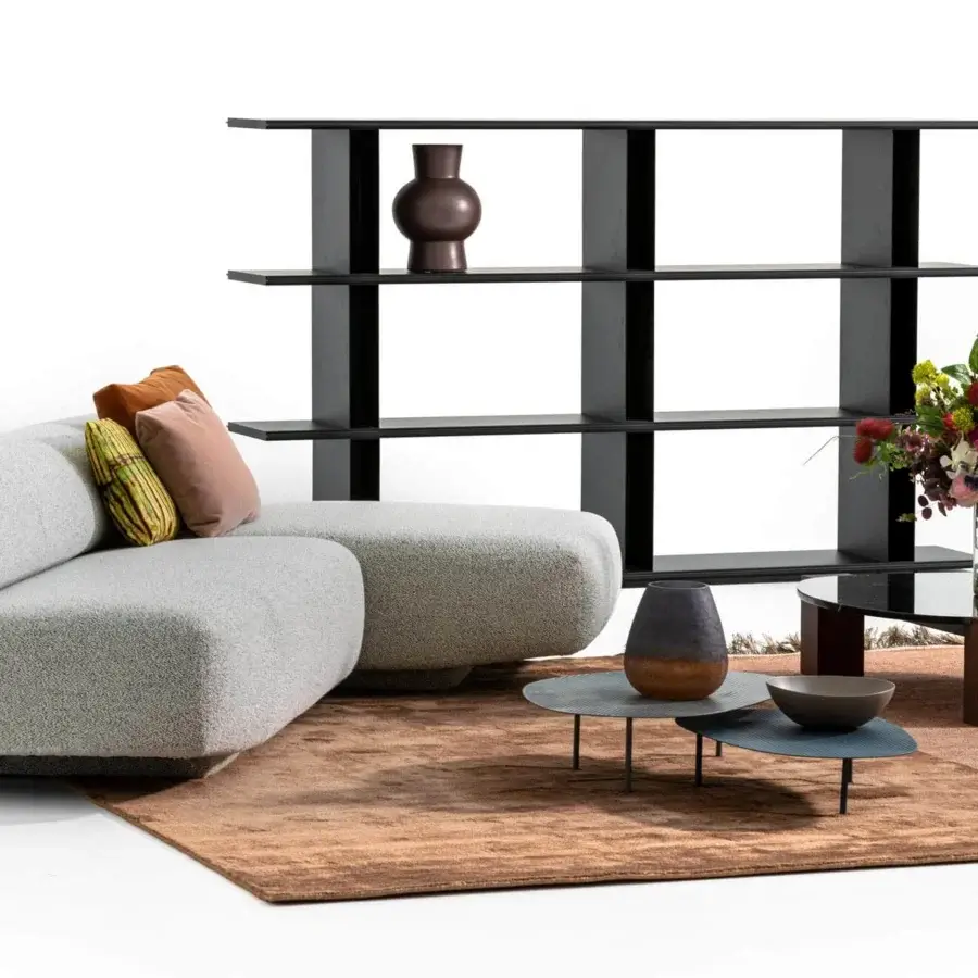 Superior Moroso Gogan sectional upholstered in textured light gray fabric with black polypropylene glides