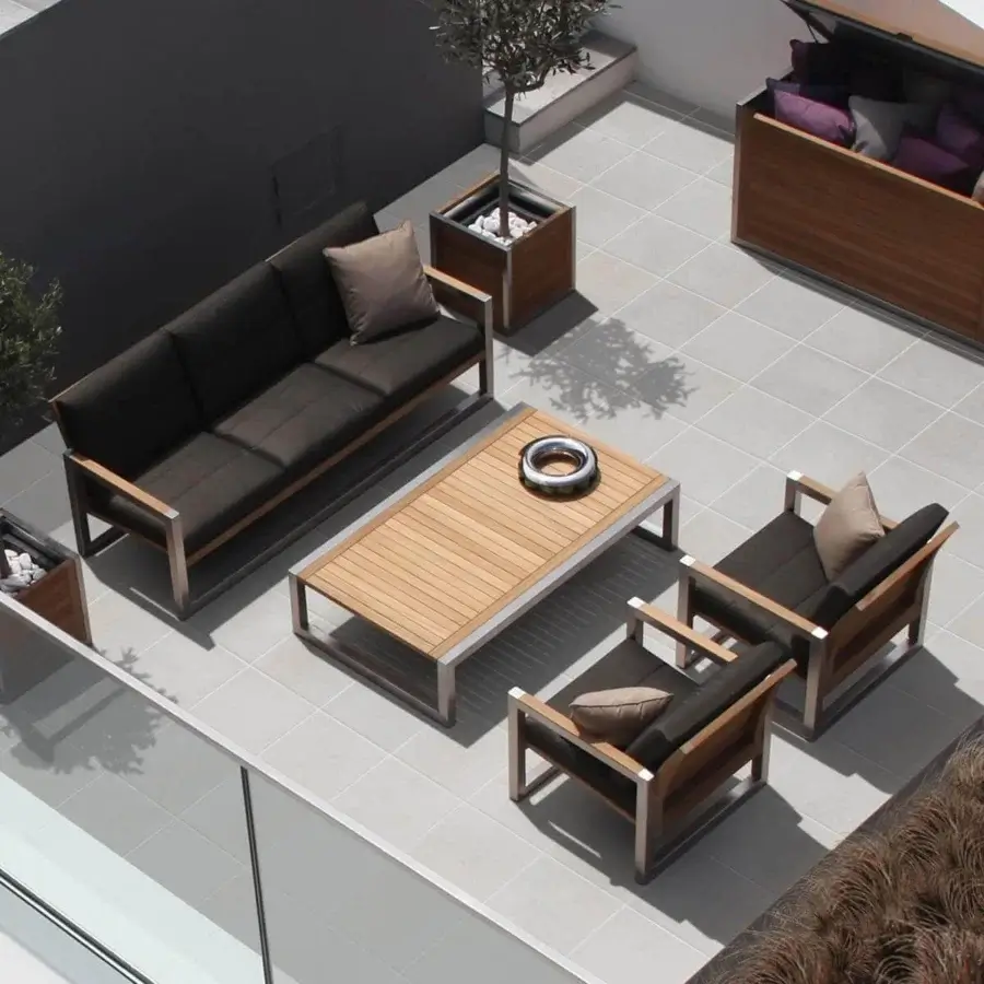Elegant Royal Botania Ninix coffee table crafted with teak wood and a sleek stainless steel frame in light brown and silver
