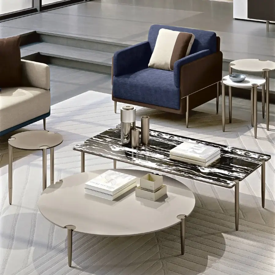 Elegant Turri Zero lounge chair with medium blue woven fabric and dark brown leather, platinum finish
