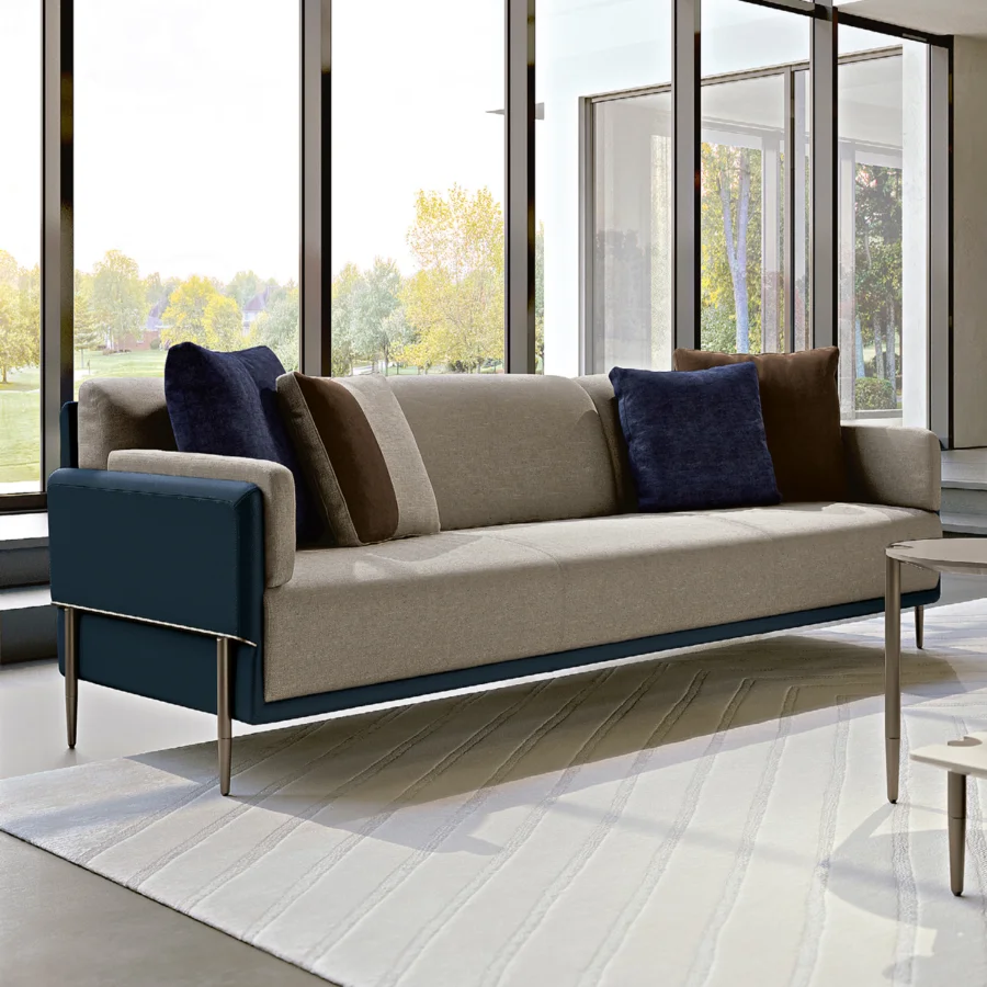 Sophisticated Turri Zero sofa with light beige textile and dark blue cushions crafted in Italian metal with a satin finish