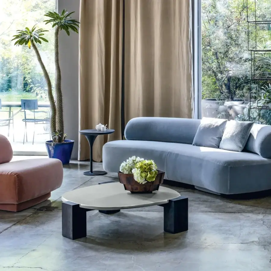Elegant Moroso Gogan coffee table with a light-colored etched glass top and dark wooden block-like legs