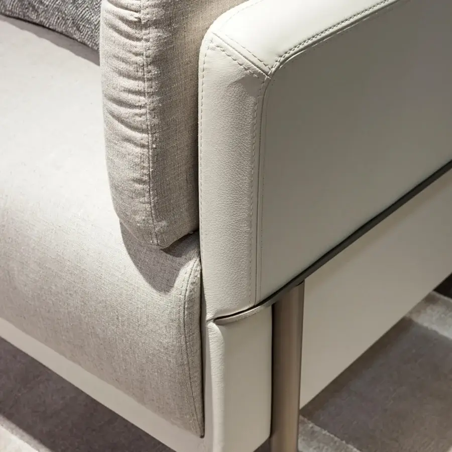 Exceptional Turri Zero sofa with platinum finish metal and light gray upholstery contrasted by textured textile cushions crafted in Italy