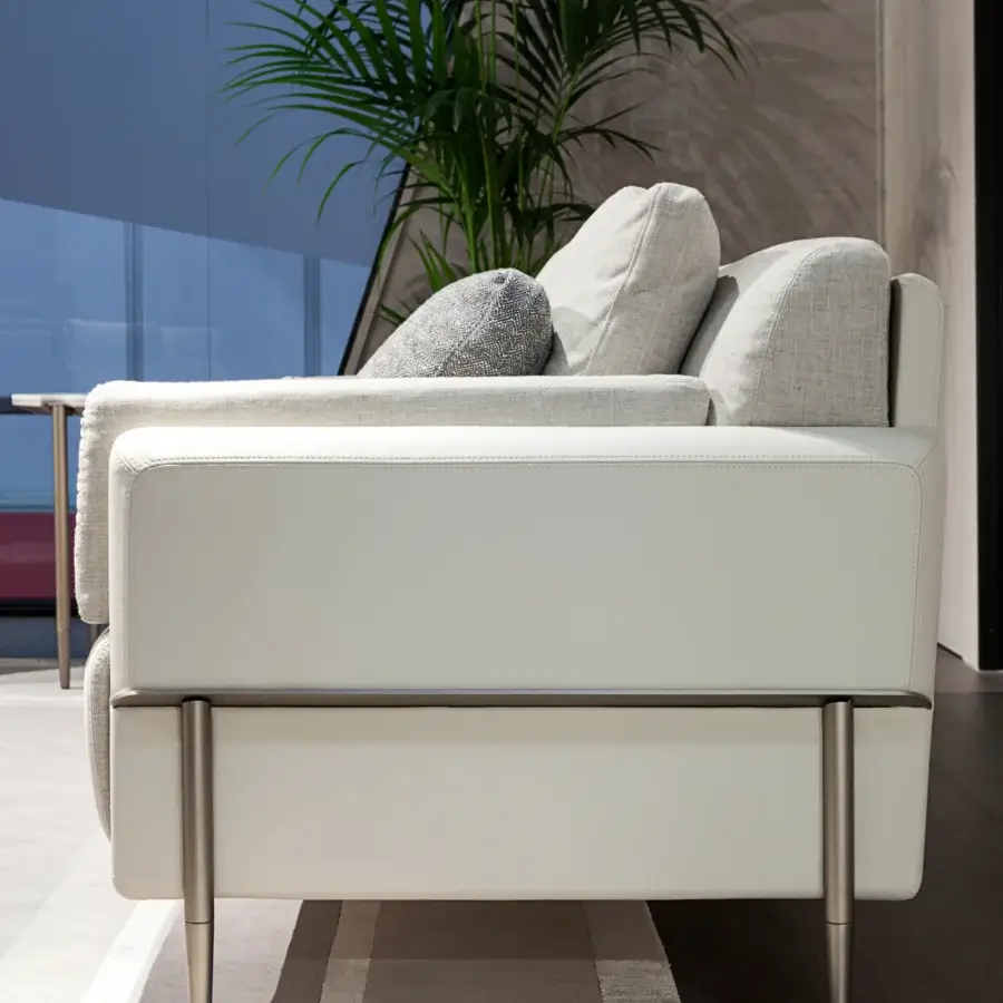 Distinguished Turri Zero sofa with bright white leather and gray fabric cushions built with a satin platinum finish metal structure