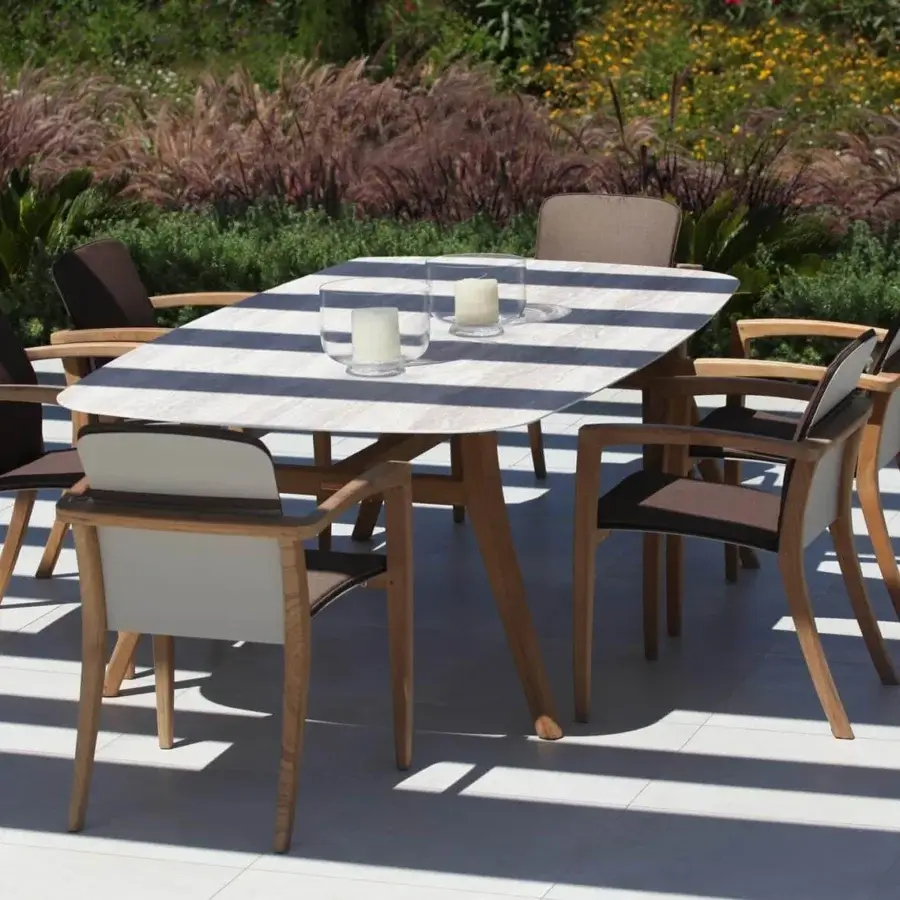 Superior Royal Botania Zidiz dining set built with teak wood frame and light striated top paired with brown fabric chairs