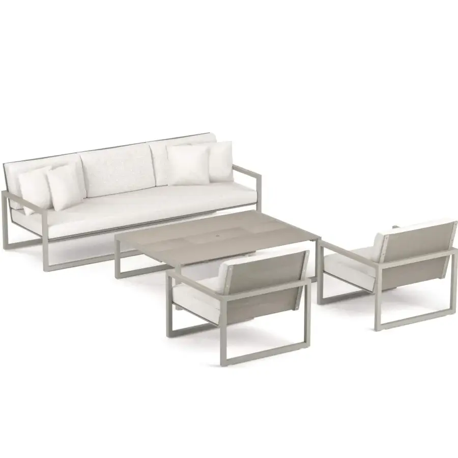 Elegant Royal Botania Ninix lounge sofa with stainless steel frame in matte grey and light textile cushions, paired with a rectangular coffee table