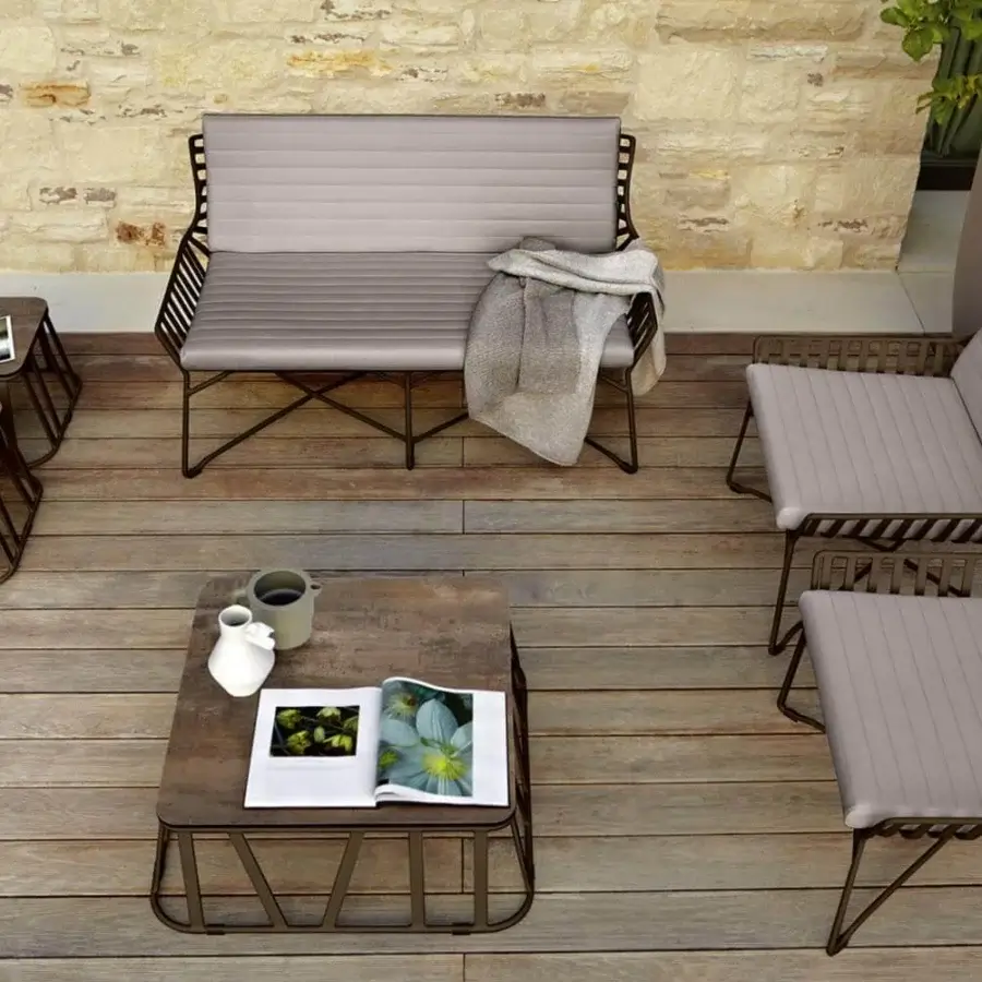 Sophisticated Roberti Rattan Hamptons Graphics coffee table with a warm brown HPL top and powder-coated aluminum base in a matte finish