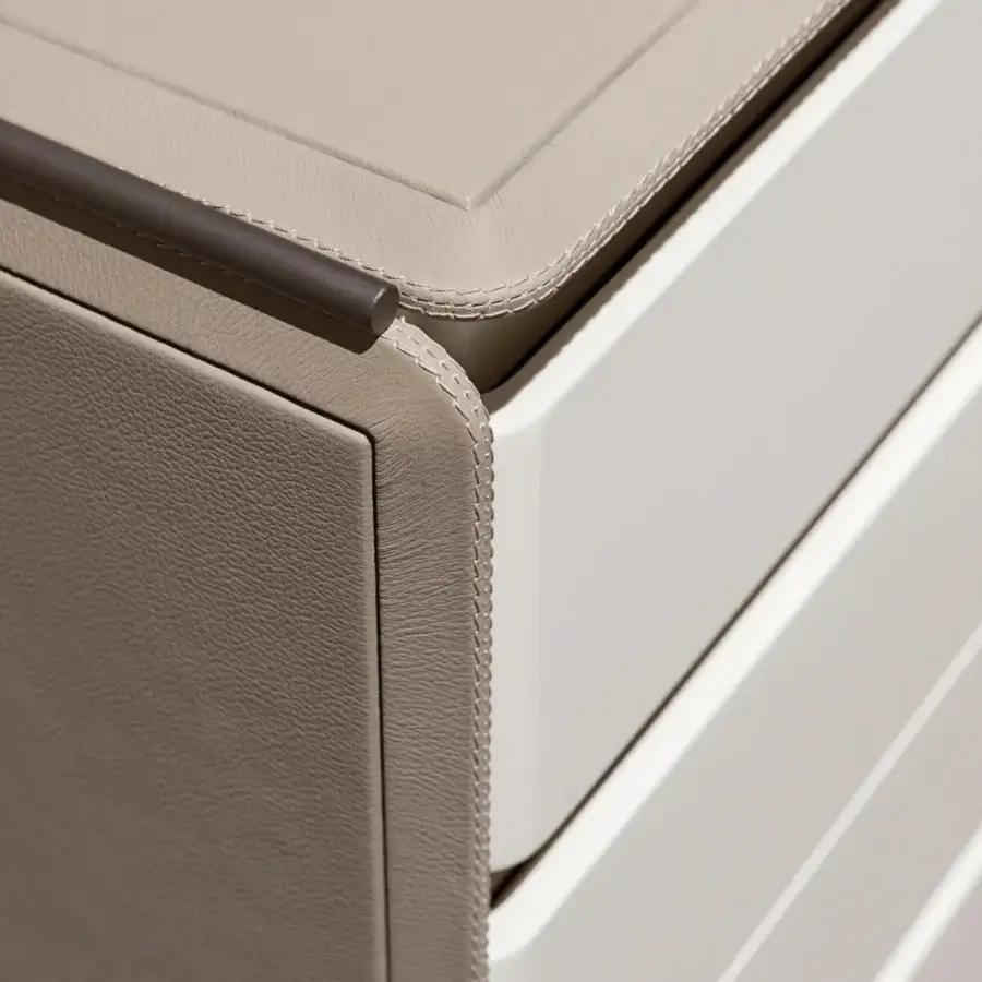 Elegant Turri Zero dresser with rounded drawers, light taupe leather and glossy lacquered white wood, plus microfiber interior