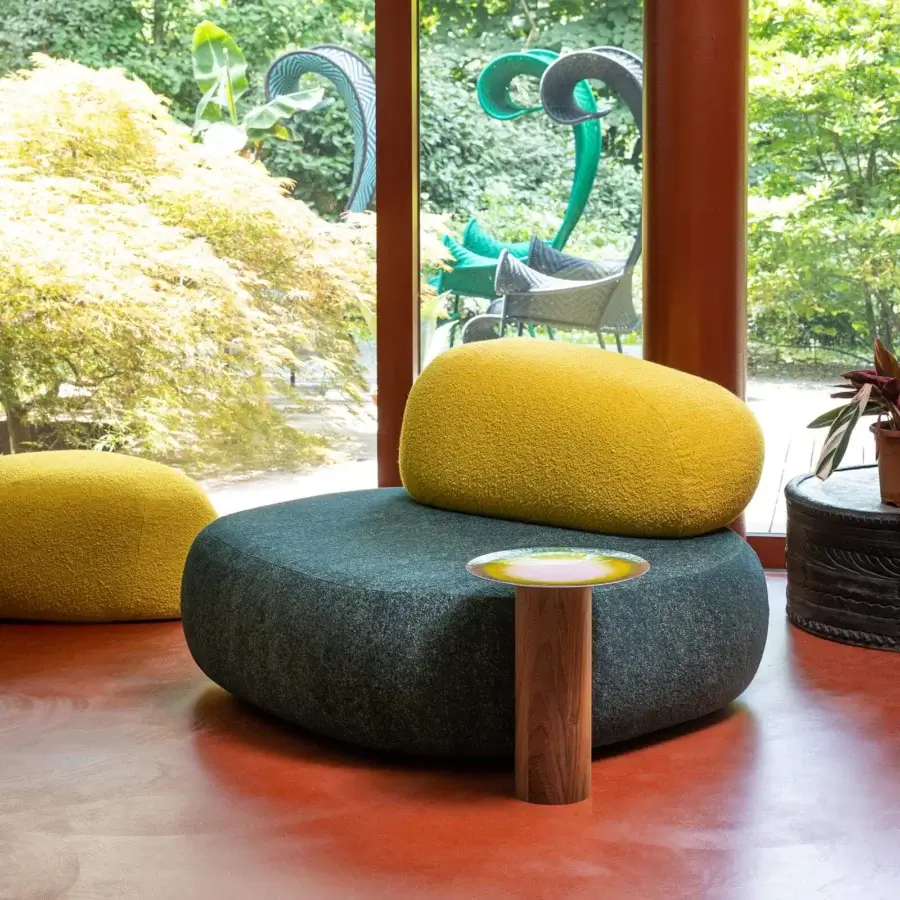 Distinguished Moroso Pebble Rubble lounge chair with organic form upholstered in textured dark mottled blue-grey fabric and wooden structure