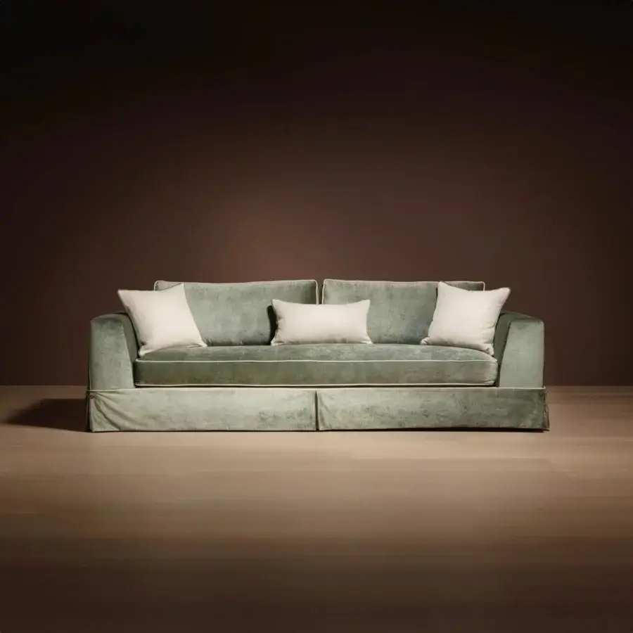 Sophisticated Bellavista Filippo sofa with light green fabric, channeled goose down cushions and concealed ashwood feet