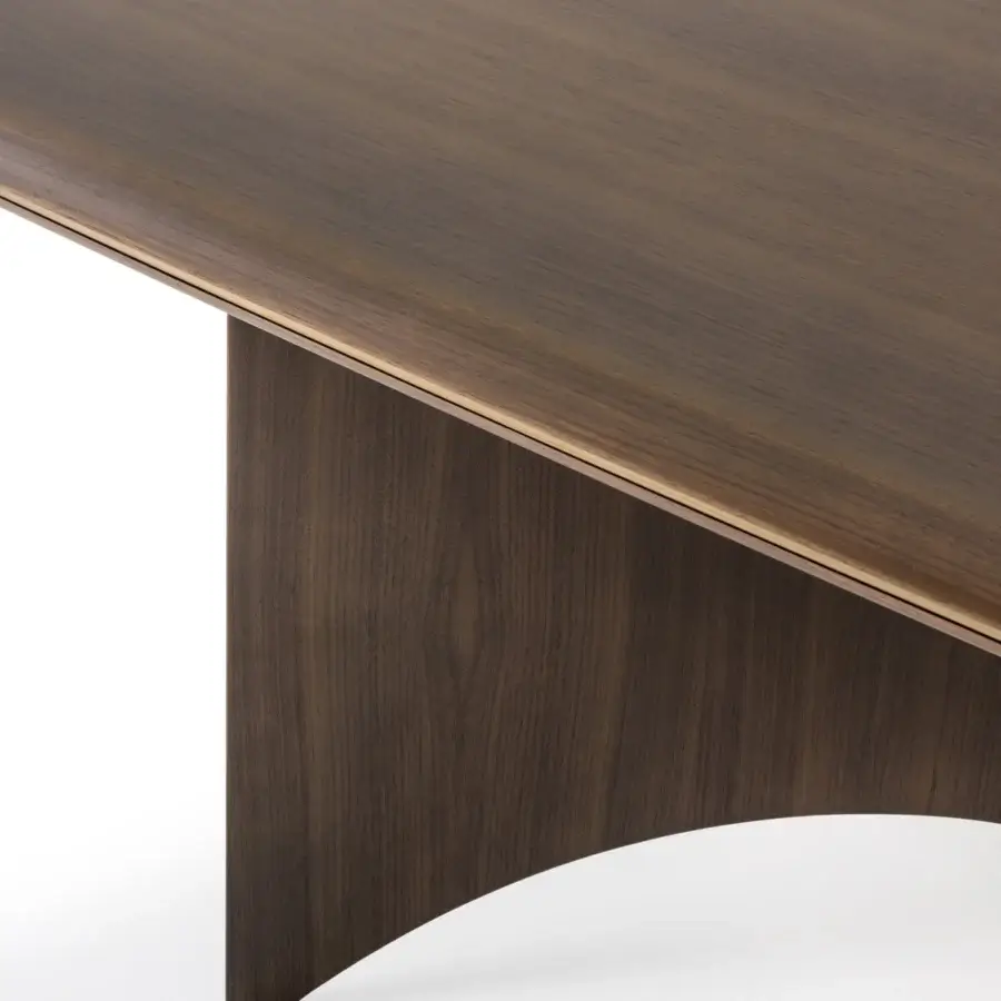 Elegant Turri Blues table with walnut wood top, wings-inspired base and metal detailing in a smooth matte finish