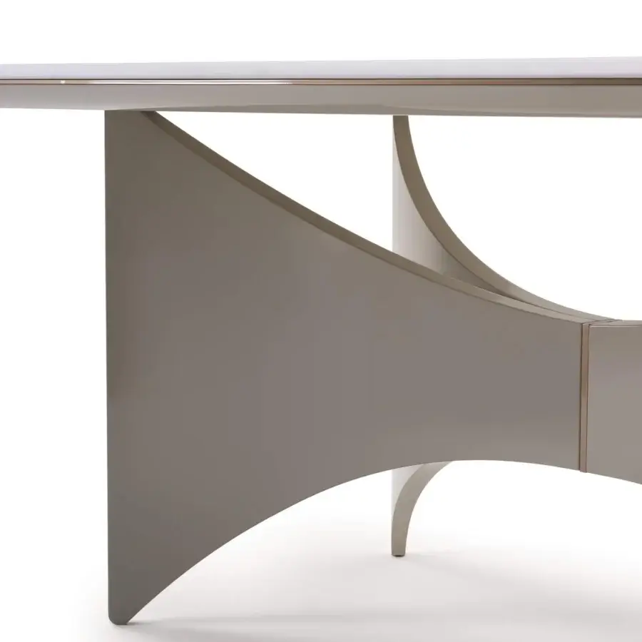 Distinguished Turri Blues table with wings-inspired base and light lines, built with glossy gray-beige lacquer and metal detailing