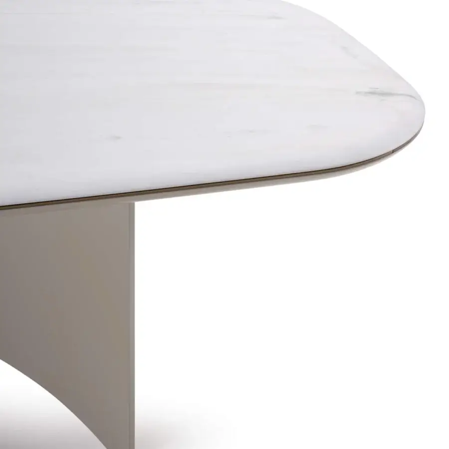 Elegant Turri Blues table with rounded light marble top and curving matte gray material base crafted with metal detail
