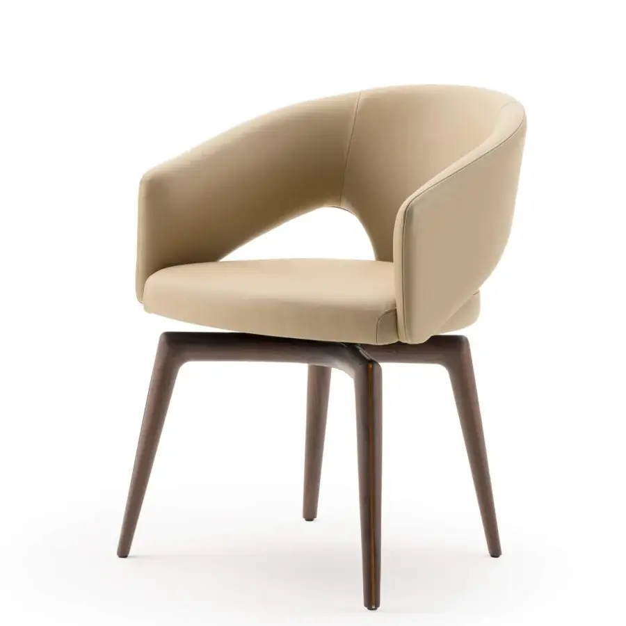 Exceptional Turri Blues armchair exhibits a sinuous unified form with light beige upholstery and tapered dark brown wooden legs
