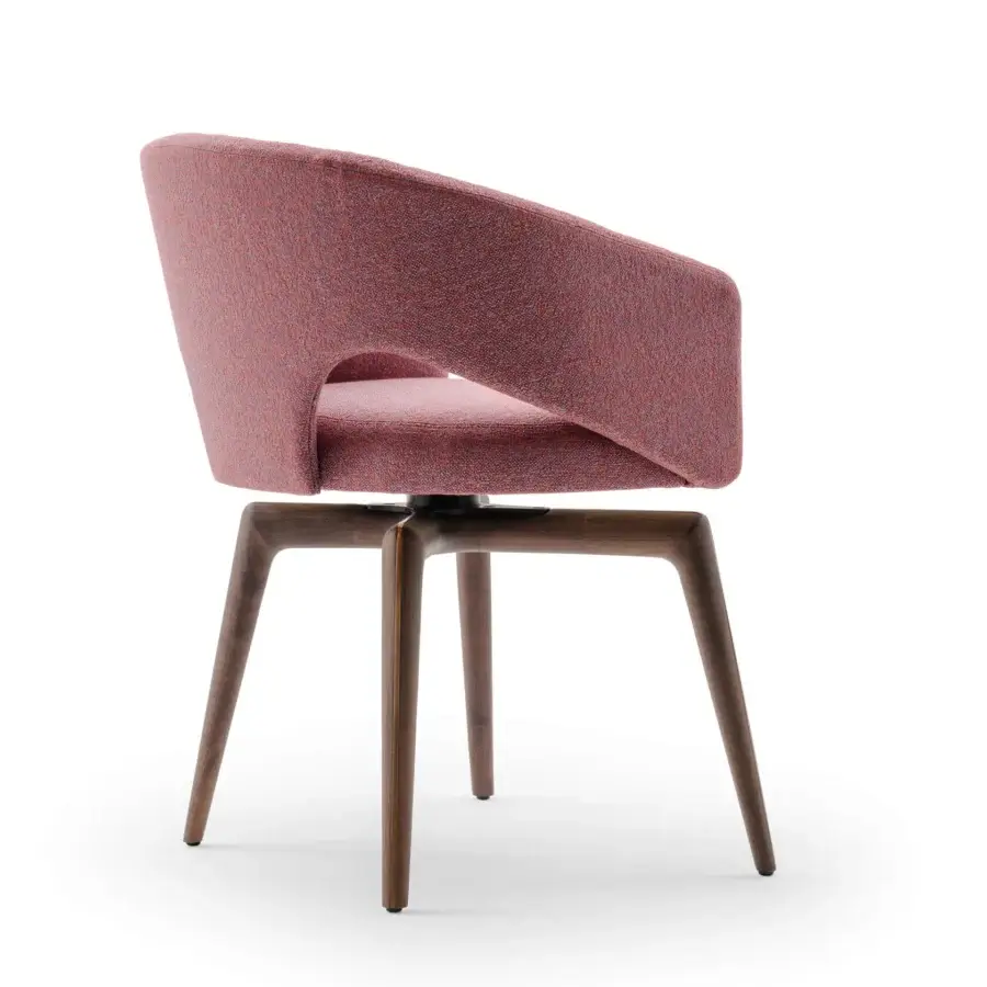 Distinguished Turri Blues armchair exhibits a sinuous silhouette with reddish-pink heathered textile upholstery and matte wooden legs