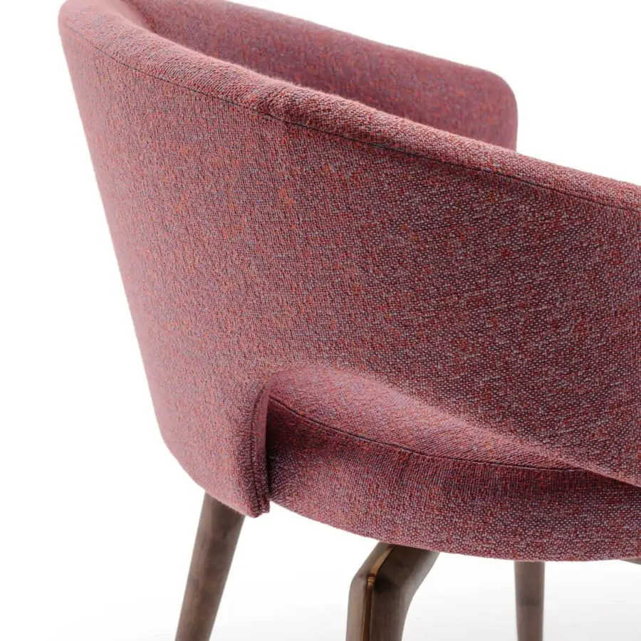Superior Turri Blues armchair exhibits a sinuous form upholstered in woven red and grey tones with dark-stained wood legs and gilded metal accents