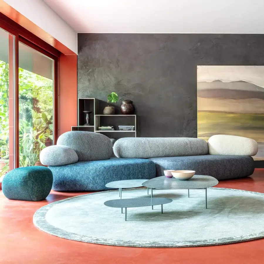Distinguished Moroso Pebble Rubble sectional with organic shapes upholstered in textured blue fabric and gray teal cushions, crafted in Italy with a matte finish