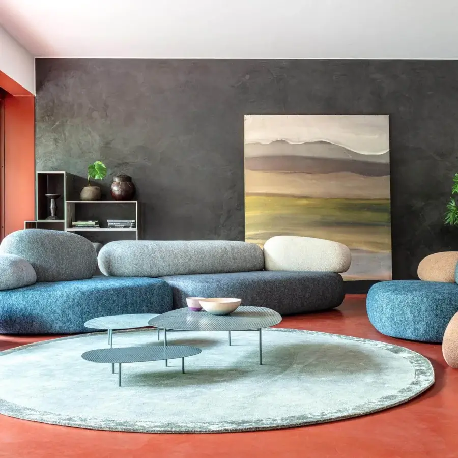Innovative Moroso Pebble Rubble sectional with organic form upholstered in varying textures of blue and gray fabric crafted in Italy
