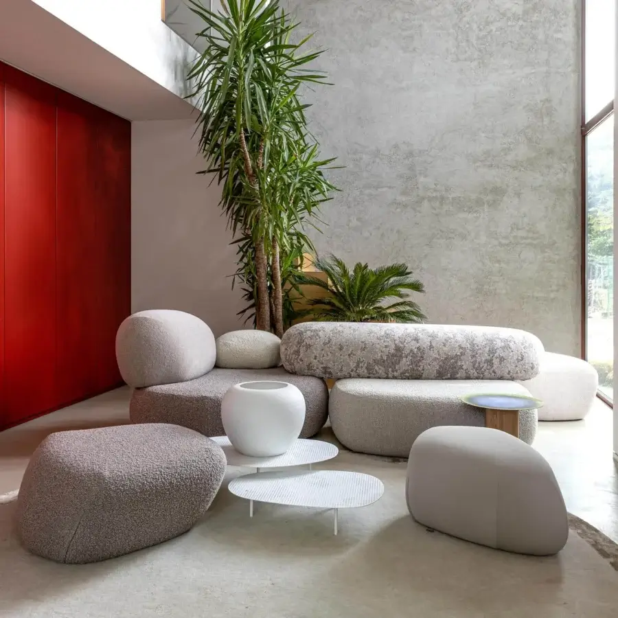 Distinguished Moroso Pebble Rubble sectional with curved silhouettes upholstered in textured light gray and beige fabric
