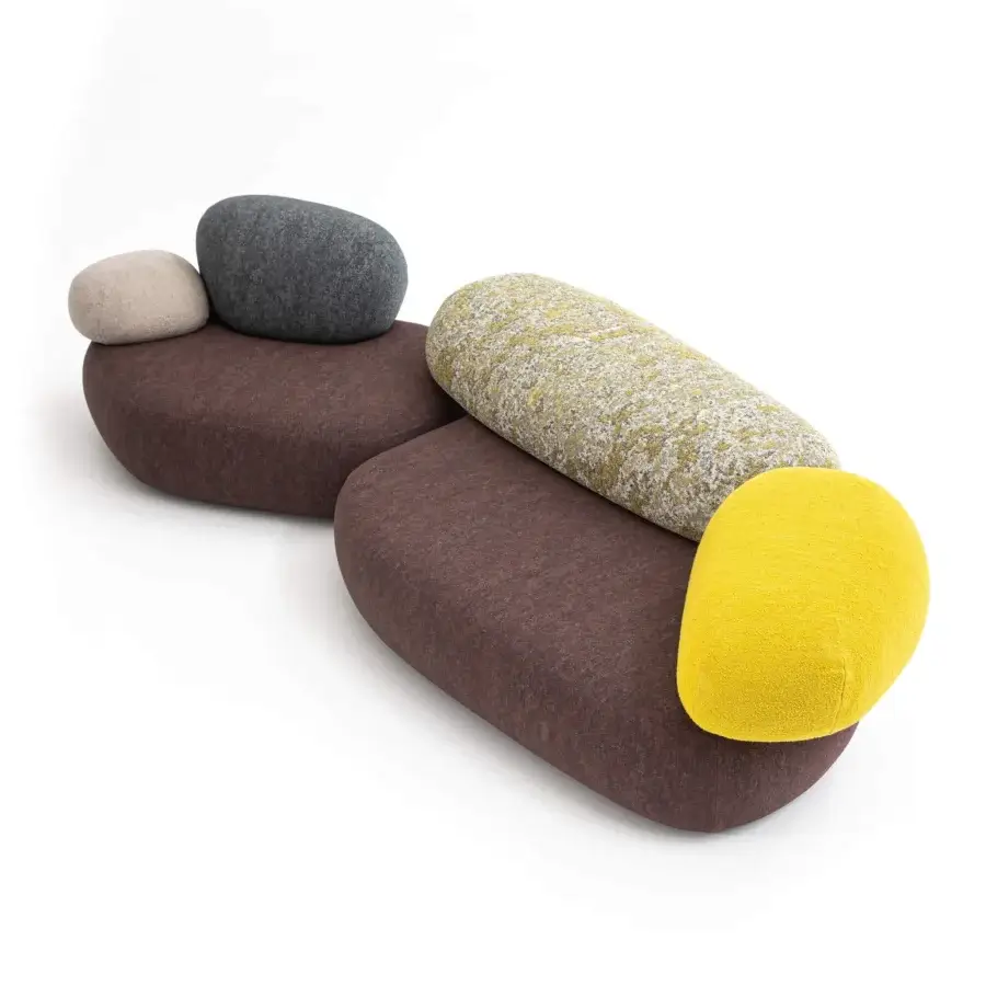 Superior Moroso Pebble Rubble sectional with organic forms upholstered in curated textiles including brown-red, beige, gray, and yellow hues