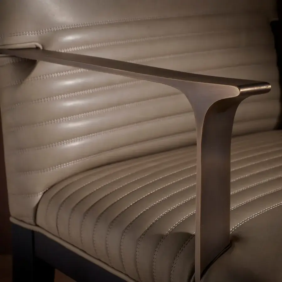 Exceptional Bellavista Masaryk chair upholstered in muted beige fabric with cast brass armrests and a solid Moka Beechwood base