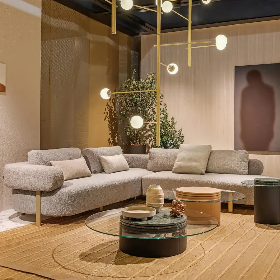 Superior Turri Roma sectional with curved silhouette upholstered in light gray textured textile and champagne gold metal feet