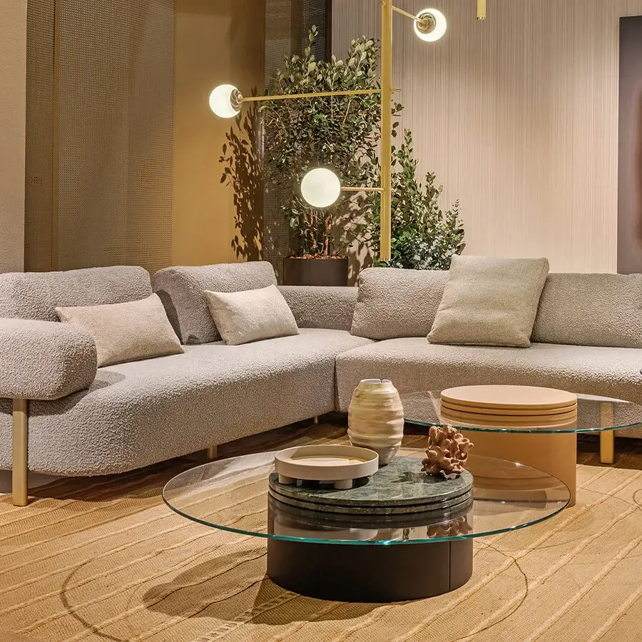 Distinguished Turri Roma sectional with plush armrests and independent cushions upholstered in light gray textured fabric with champagne gold feet
