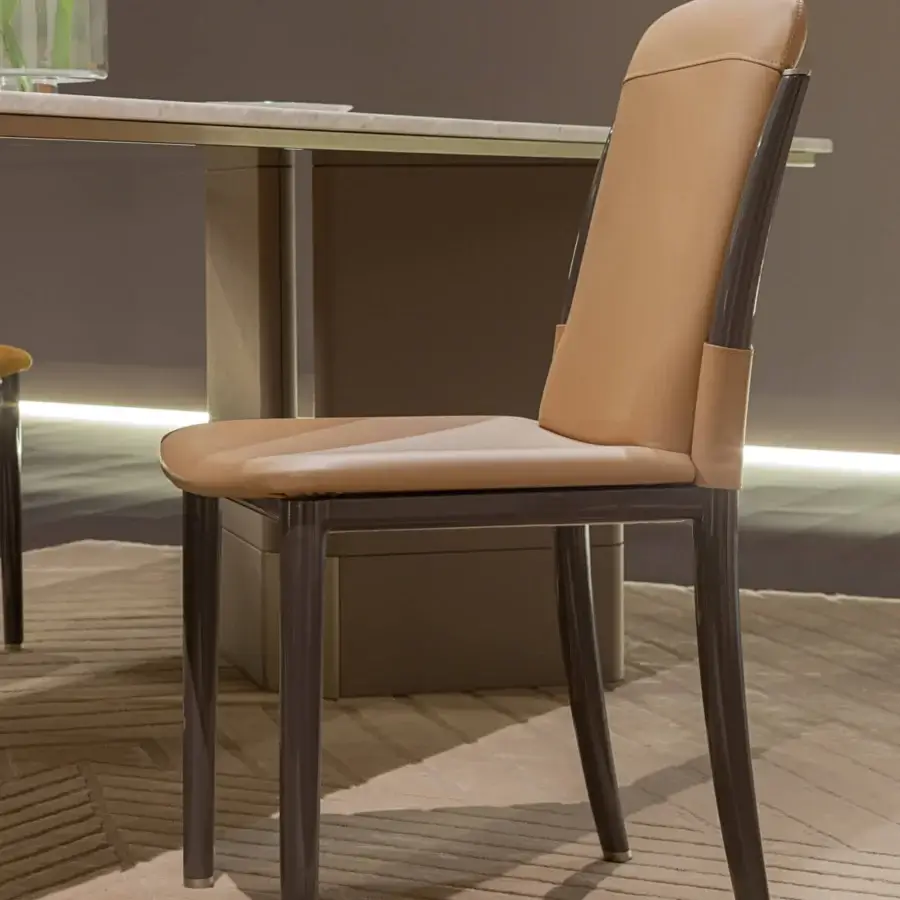 Exclusive Turri Zero chair with curved light tan upholstery, glossy dark brown lacquered wood and metal accents