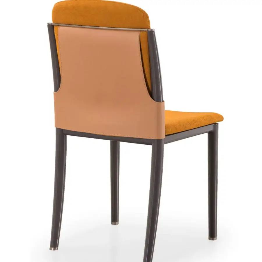 Sophisticated Turri Zero chair upholstered in textured mustard yellow fabric with a light brown leather back and lacquered wooden legs